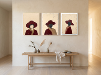 Three Women in Hats Triptych — 3 Original Oils, Wine — original hand-painted oil shown on the wall in a styled room