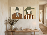 Cowboy & Wide-Brim Lady — Set of 2 Original Oils, Olive & Rust — original hand-painted oil shown on the wall in a styled room