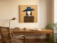 Woman in a Wide Hat Wall Art — Original Palette-Knife Oil, Ochre & Navy — original hand-painted oil shown on the wall in a styled room
