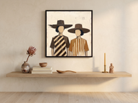 Two Women in Hats Wall Art — Original Palette-Knife Oil, Chocolate & Caramel — original hand-painted oil shown on the wall in a styled room