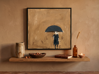 Woman Under an Umbrella Wall Art — Original Oil, Navy & Ochre — original hand-painted oil shown on the wall in a styled room