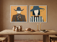 Cowboy & Wide-Brim Lady — Set of 2 Original Oils, Ochre & Slate Blue — original hand-painted oil shown on the wall in a styled room
