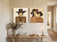 Cowboy & Two Cowgirls — Set of 2 Original Oils, Caramel & Rust — original hand-painted oil shown on the wall in a styled room