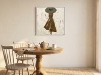 Walking Lady in a Wide Hat Wall Art — Original Palette-Knife Oil, Olive & Sienna — original hand-painted oil shown on the wall in a styled room