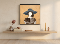 Woman in a Floppy Hat Wall Art — Original Palette-Knife Oil, Ochre & Navy — original hand-painted oil shown on the wall in a styled room