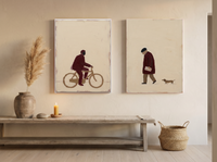 Cyclist & Newspaper Man — Set of 2 Original Oils, Wine & Oat — original hand-painted oil shown on the wall in a styled room