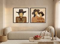 Cowboy & Two Cowgirls — Set of 2 Original Oils, Caramel & Rust — original hand-painted oil shown on the wall in a styled room