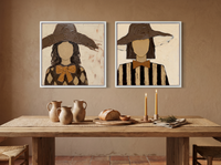 Two Women in Floppy Hats — Set of 2 Original Oils, Chocolate & Gold — original hand-painted oil shown on the wall in a styled room