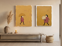 Woman with Umbrella & Woman with Bouquet — Set of 2 Original Oils, Mustard & Rose — original hand-painted oil shown on the wall in a styled room