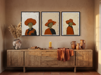 Three Women in Hats Triptych — 3 Original Oils, Burnt Orange — original hand-painted oil shown on the wall in a styled room