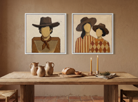 Cowboy & Two Cowgirls — Set of 2 Original Oils, Caramel & Rust — original hand-painted oil shown on the wall in a styled room