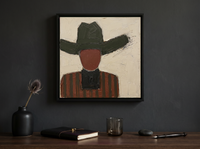 Cowboy in a Wide Hat Wall Art — Original Palette-Knife Oil, Charcoal & Oxblood — original hand-painted oil shown on the wall in a styled room