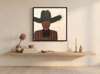 Cowboy in a Wide Hat Wall Art — Original Palette-Knife Oil, Charcoal & Oxblood — original hand-painted oil shown on the wall in a styled room
