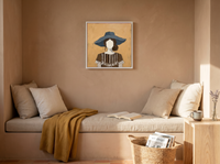 Woman in a Floppy Hat Wall Art — Original Palette-Knife Oil, Ochre & Navy — original hand-painted oil shown on the wall in a styled room