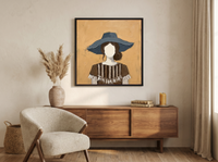 Woman in a Floppy Hat Wall Art — Original Palette-Knife Oil, Ochre & Navy — original hand-painted oil shown on the wall in a styled room