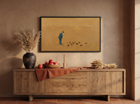 Man Feeding Pigeons Wide Wall Art — Original Oil Landscape, Golden Ochre & Navy — original hand-painted oil shown on the wall in a styled room