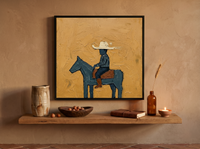 Cowboy on Horseback Wall Art — Original Palette-Knife Oil, Navy & Ochre — original hand-painted oil shown on the wall in a styled room