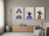 Three Women in Hats Triptych — 3 Original Oils, Periwinkle — original hand-painted oil shown on the wall in a styled room