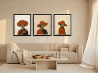 Three Women in Hats Triptych — 3 Original Oils, Burnt Orange — original hand-painted oil shown on the wall in a styled room
