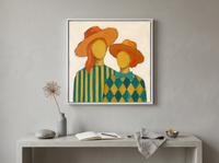 Two Ladies in Orange Hats Wall Art — Original Palette-Knife Oil, Orange & Teal — original hand-painted oil shown on the wall in a styled room